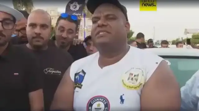 'Video thumbnail for Egyptian wrestler pulls 20 cars in bid for world record'