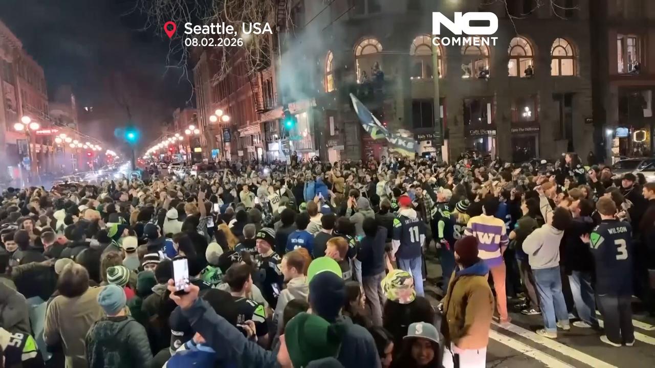 Video thumbnail for Fans with fireworks celebrate Super Bowl in Seattle streets