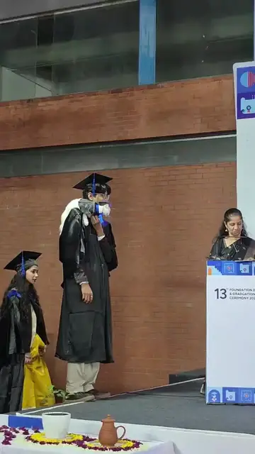 Video thumbnail for Architecture Graduate Receiving Degree with Cat Companion on Stage