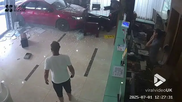 'Video thumbnail for VV5025 CCTV catches small sedan suddenly crashing into a hotel.'