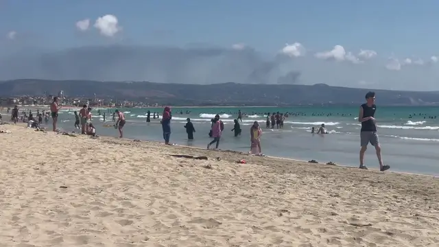 Video thumbnail for Lebanon: Busy Beaches in Tyre Amid Nearby Israeli Military Activity.