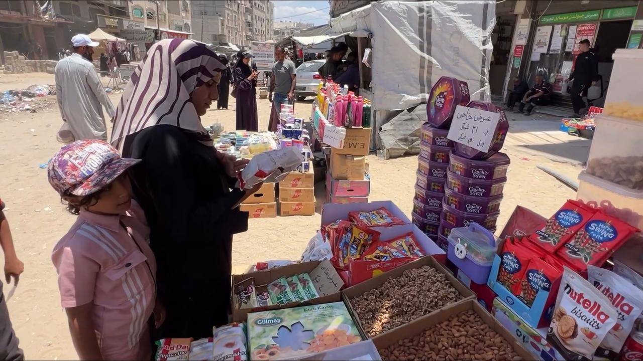Video thumbnail for Palestinians prepare for Eid al-Adha in Gaza marketplaces amid blockade.