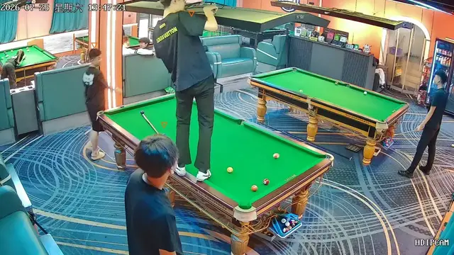 Video thumbnail for Cue Ball Gets Stuck in Overhead Light During Billiards Game