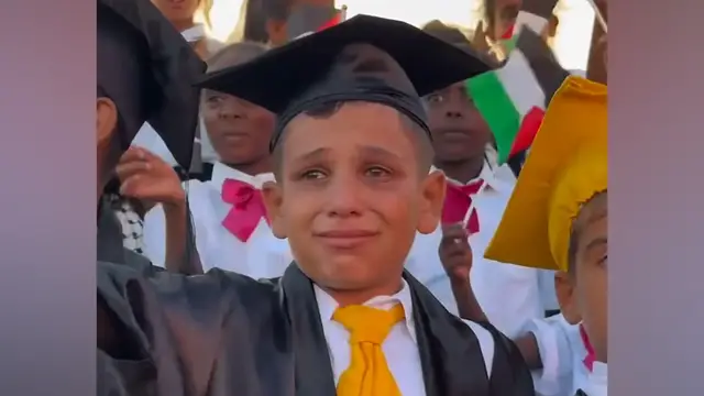 'Video thumbnail for Children in Gaza take part in makeshift school graduation'