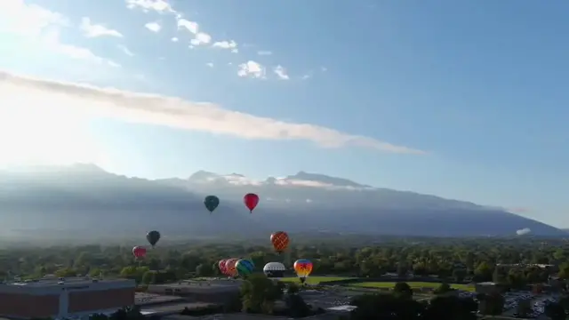 Video thumbnail for US: Colorful Hot Air Balloons Fill The Sky Over Utah Valley.