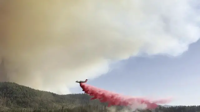Video thumbnail for US: Huge Wildfire Triggers Aerial Assault As Flames Spread Across Washington Lands.