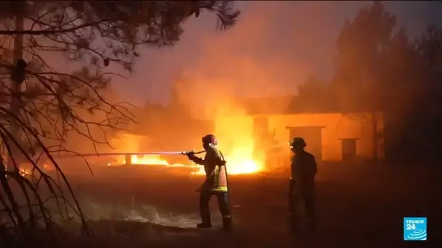Video thumbnail for French firefighters work tirelessly to stop blaze from spreading