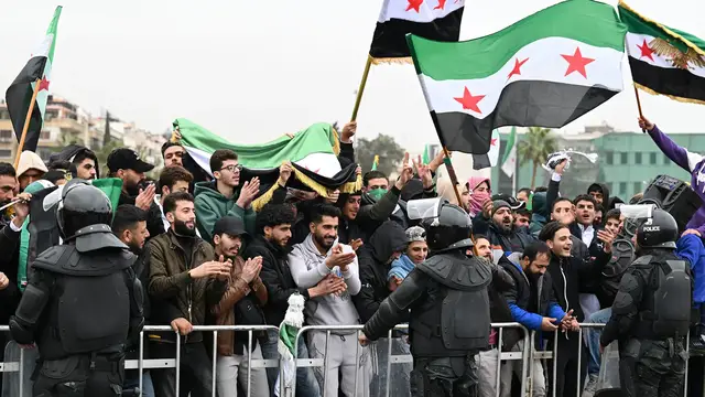 Video thumbnail for Syrians gather to mark one year since the fall of the Assad regime