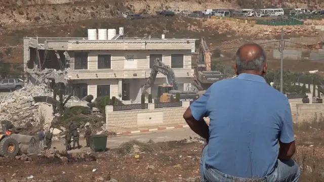Video thumbnail for Israeli forces demolish two-story home in occupied East Jerusalem.