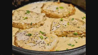 'Video thumbnail for Smothered Boneless Pork Chops In Creamy Garlic Sauce'