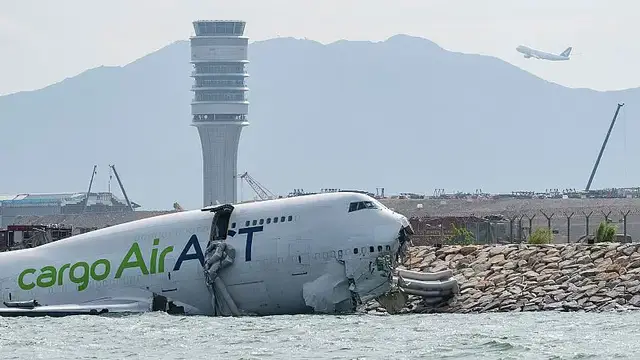 'Video thumbnail for Cargo plane skids off Hong Kong runway, killing two airport workers'