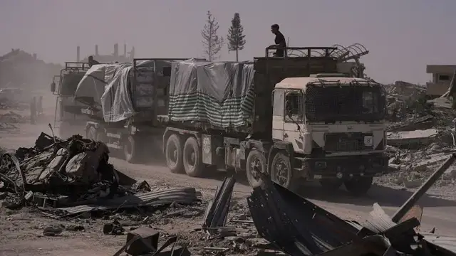'Video thumbnail for Humanitarian Aid trucks roll into Gaza amid fragile ceasefire'