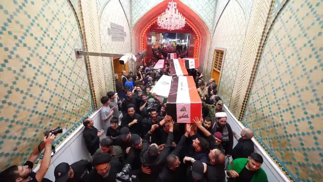 Video thumbnail for Iraq: Funeral held for PMF, IRGC members in Iraq.