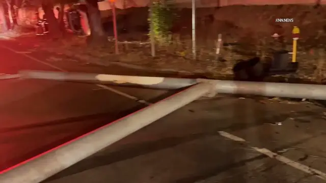 Video thumbnail for US, Los Angeles: Encino SUV Collision Knocks Down Streetlight and Blocks Traffic.