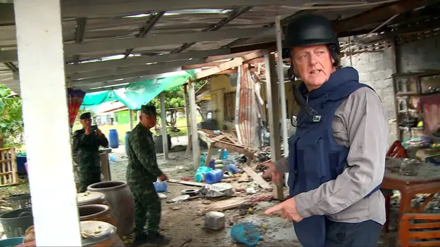 Video thumbnail for Thai military shows media border damage as new Cambodian rocket barrage hits