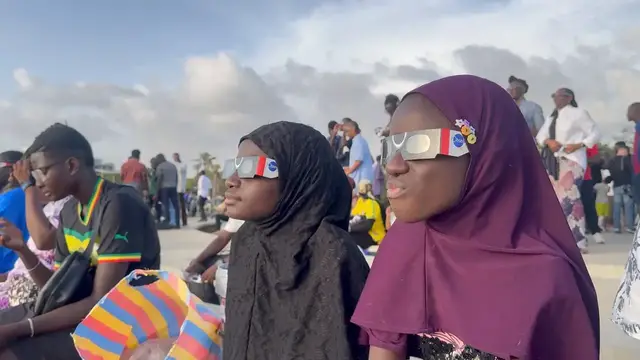 Video thumbnail for Senegal: Senegalese people turn their eyes to sky for partial solar eclipse.