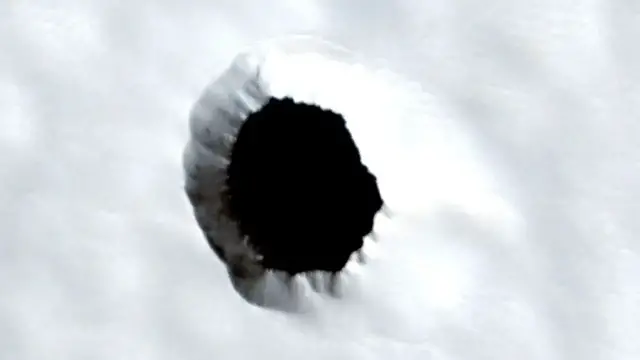 Video thumbnail for A mysterious hole on Mars raises fresh questions about its inner workings.