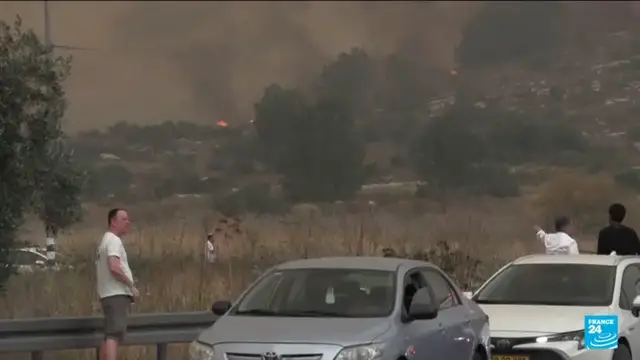Video thumbnail for Israel reopens key roads as firefighters continue to battle blazes