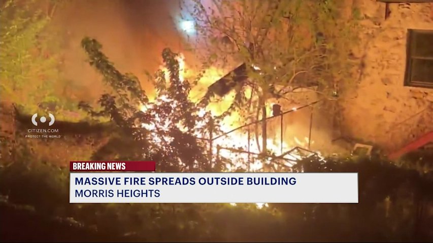 Video thumbnail for Fire rips through yard outside Morris Heights building