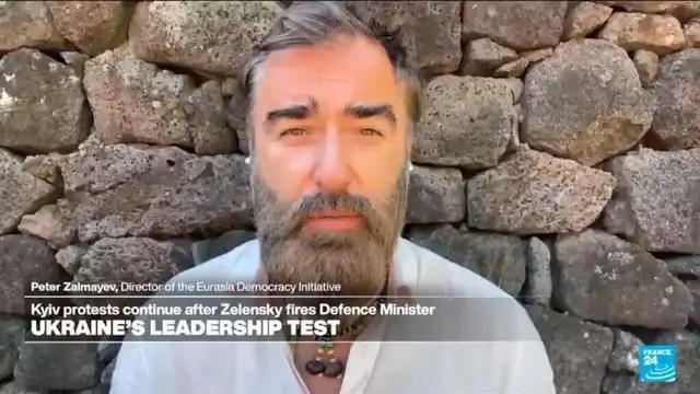 Video thumbnail for Ukrainians back ousted defence minister as political crisis brews