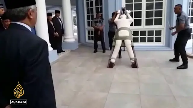 'Video thumbnail for Singapore physical punishment: Convicted scammers will be caned under new law'