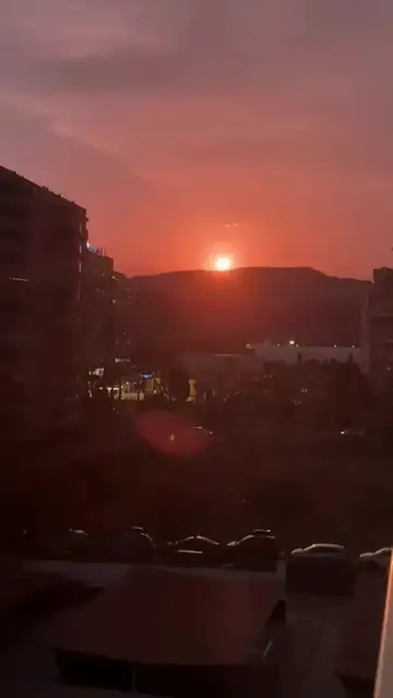 Video thumbnail for Fiery Sunset over the City Skyline and Distant Hills