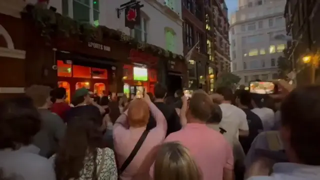 Video thumbnail for UK: Canadian fans flood London streets as historic World Cup win sends Canada into Round of 16.