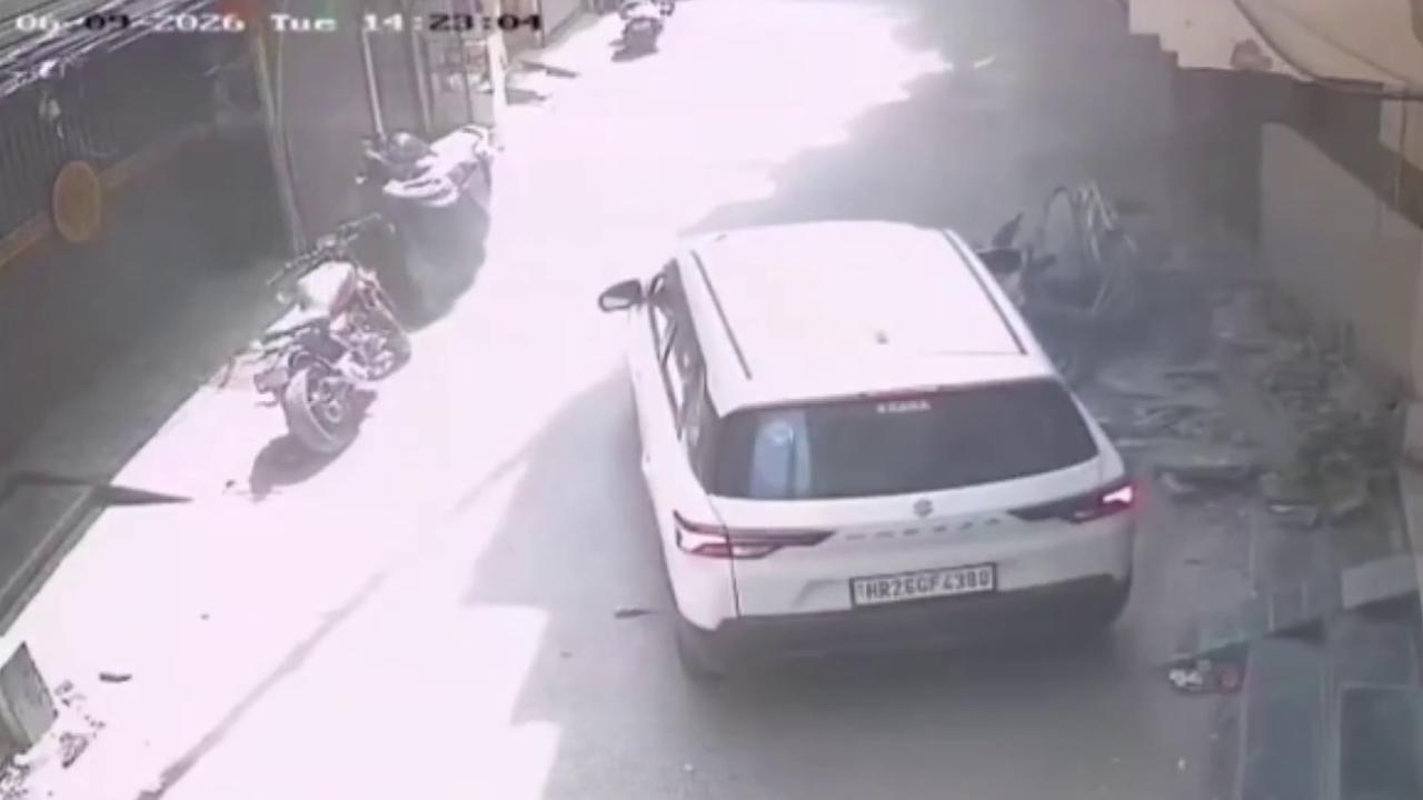 Video thumbnail for India: Speeding car strikes woman on busy road, frightening impact ends with minor injuries.