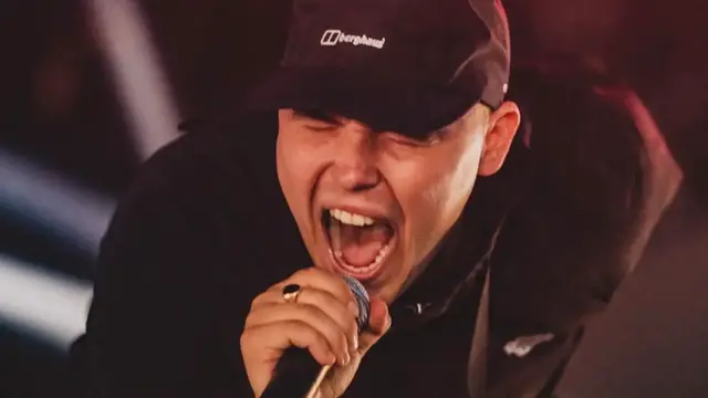 Video thumbnail for Member of Irish rap band Kneecap charged with ‘terrorism’ offence