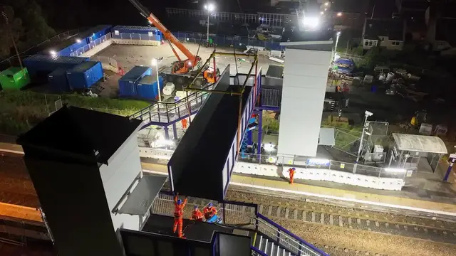 Video thumbnail for UK: $6.7 Million Footbridge Lifted Into Place Above Railway Tracks In Scotland.