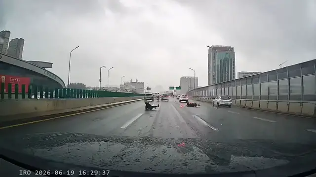 Video thumbnail for Motorcycle Slip-Up on Wet Road in Shandong!