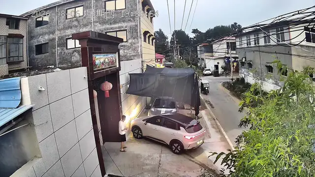 Video thumbnail for China: Chinese man narrowly avoids being hit as car suddenly rushes toward him.