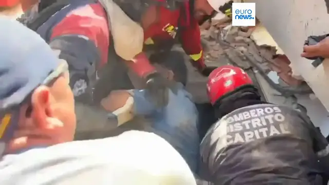 Video thumbnail for Joy as man pulled from rubble three days after Venezuela quake