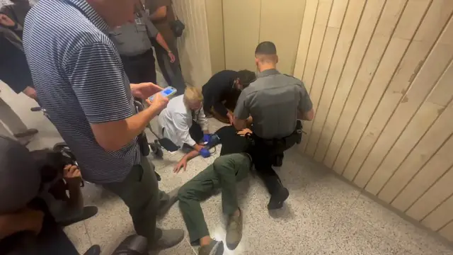 'Video thumbnail for ICE agent accused of hurting photojournalist'
