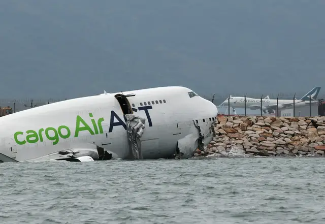 'Video thumbnail for Cargo plane skids off Hong Kong runway into sea'