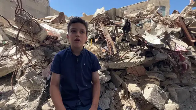 Video thumbnail for Search continues for bodies beneath home destroyed in Israeli strike.