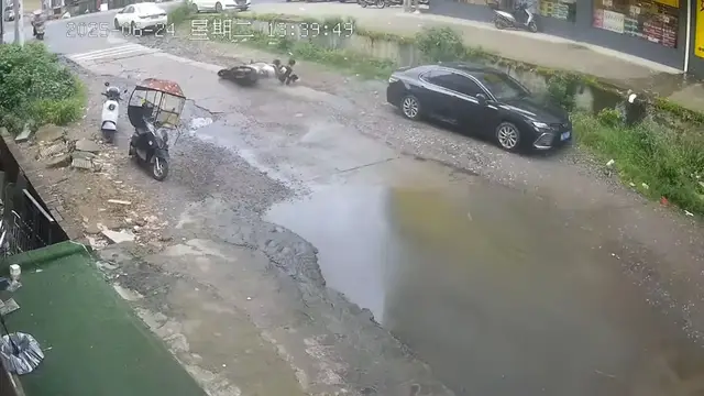 Video thumbnail for Motorcycle Swerves to Avoid Puddle and Hits Parked Car in China