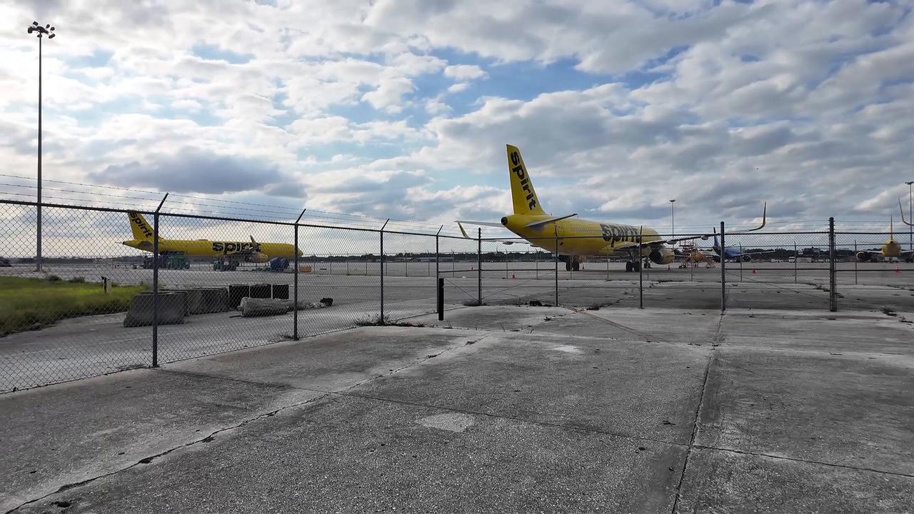 Video thumbnail for US: Spirit Airlines aircraft parked at Orlando International Airport (MCO).