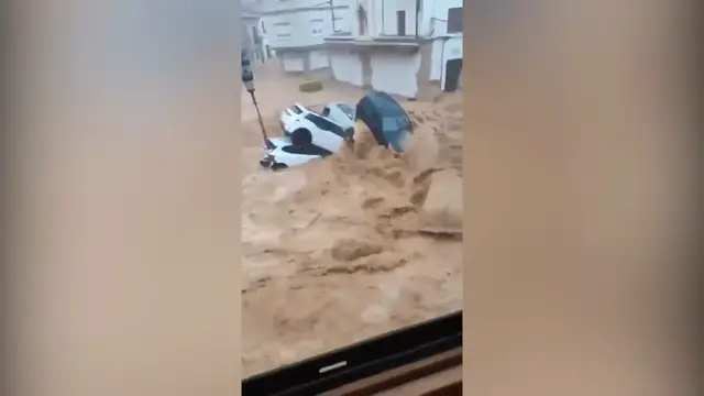 Video thumbnail for Floods sweep cars through streets after intense rain in Spain