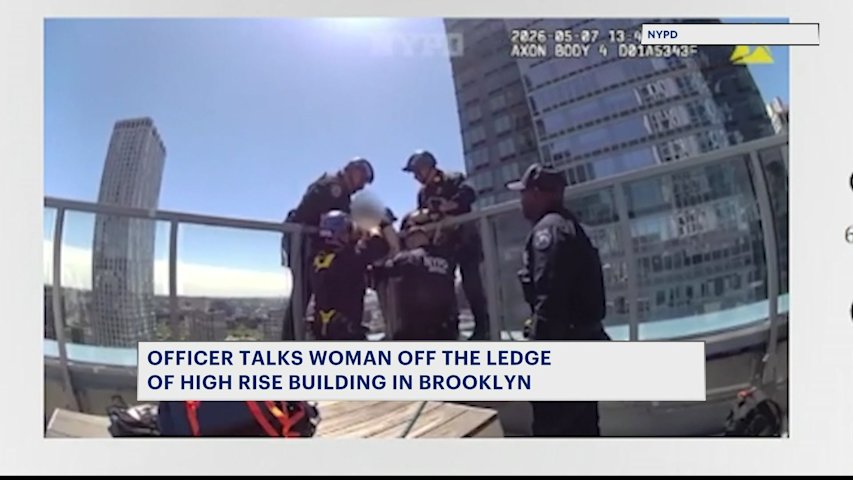 Video thumbnail for NYPD officers talk woman out of jumping off of Brooklyn high-rise