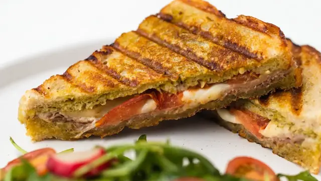'Video thumbnail for Cheesy Prosciutto Pesto Panini Recipe'