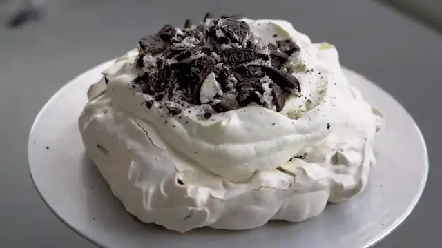'Video thumbnail for Turn Oreos Into a 5 Ingredient Fancy Dessert ¦ Cookies and Cream Pavlova ¦ Eric Kim ¦ NYT Cooking (720p 24fps)'