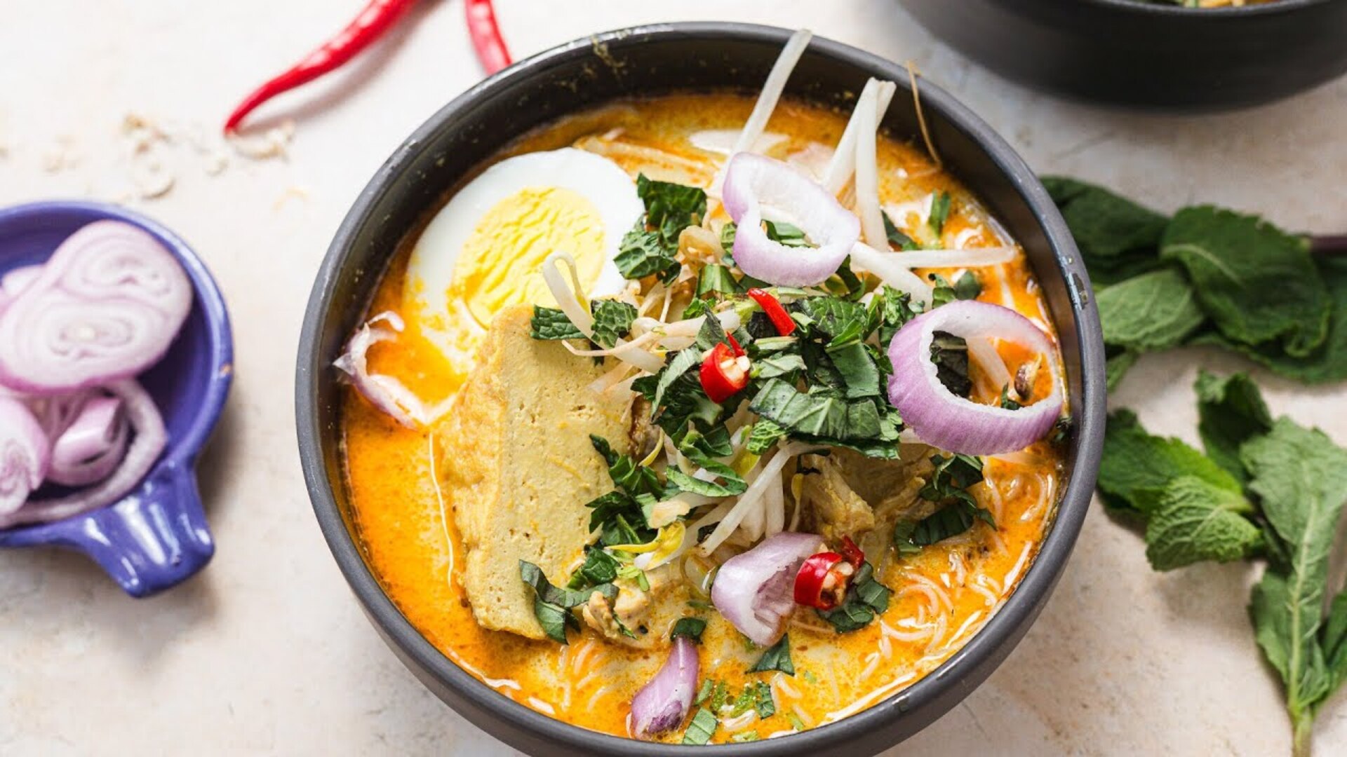 Video thumbnail for This Singapore-Style Chicken Curry Laksa Recipe Is Bursting With Bold Aromatics