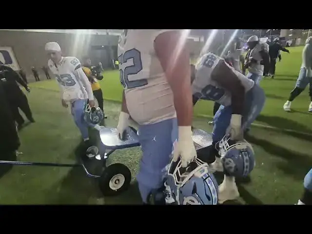 Video thumbnail for #UNC players wheel the Victory Bell from the field to the dressing room