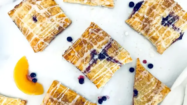 Video thumbnail for Almond-Glazed Blueberry Peach Hand Pies Recipe