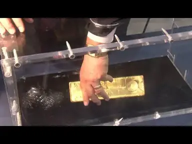'Video thumbnail for CoinWeek Classic: APMEX Displays 400 Ounce Gold Bar at ANA World’s Fair of Money 2014'