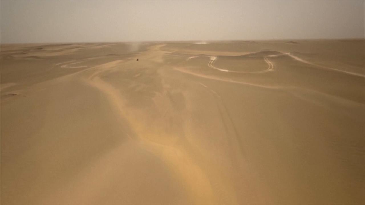 Video thumbnail for China: Competitors race along rocky desert roads during grueling Taklimakan Rally stage.