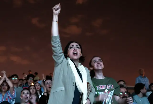 Video thumbnail for Iranians gather in Tehran to support team in critical draw against Belgium