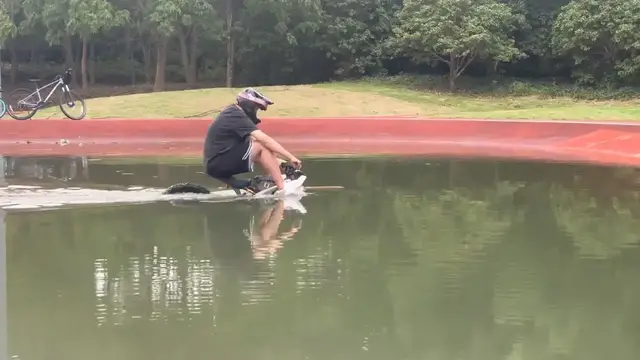 Video thumbnail for Cyclist Rides Through Deep Water in Jiangsu, China