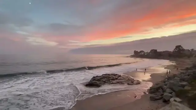 Video thumbnail for Sunset Over Calm Ocean and Rocky Shore in Santa Cruz